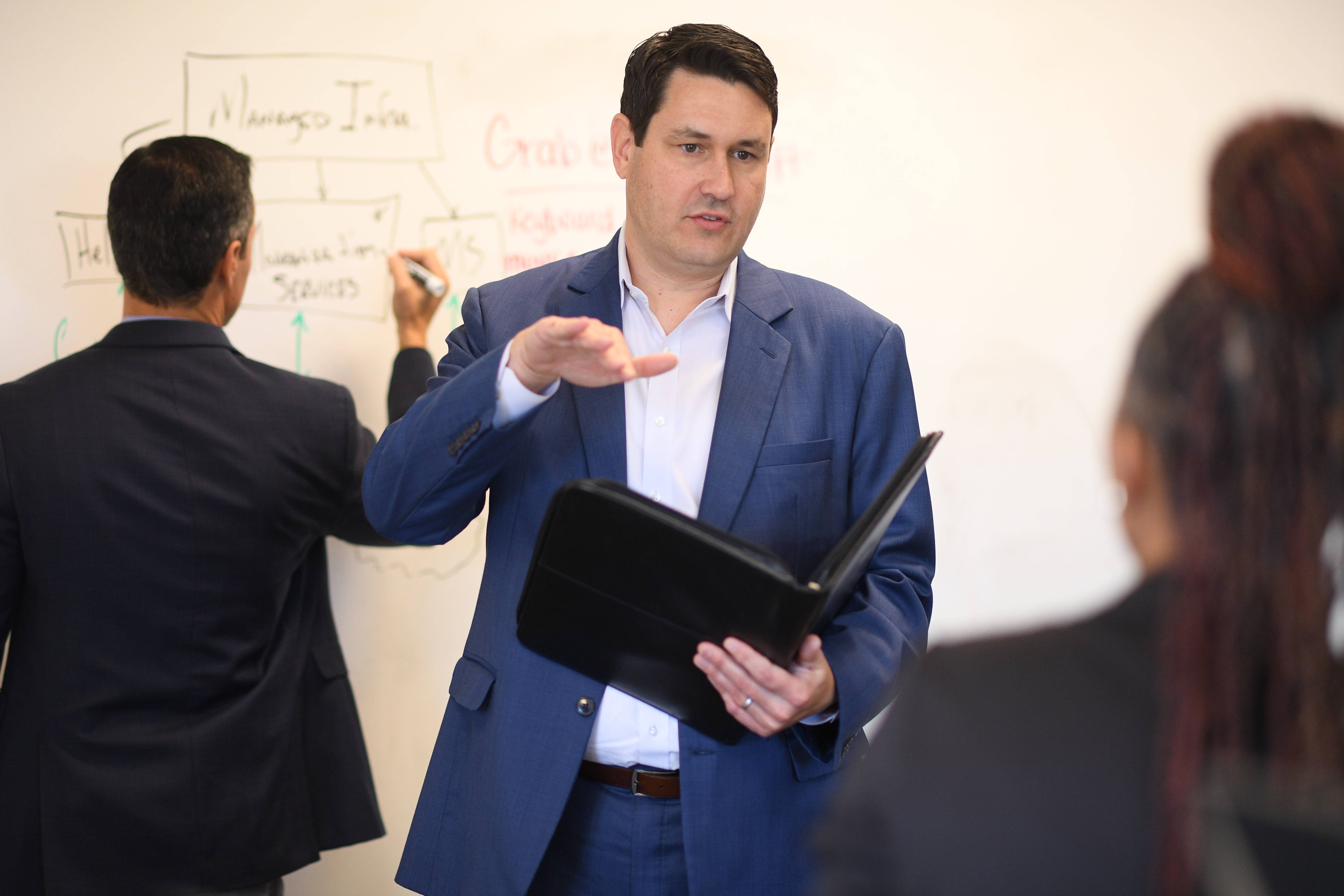 Man doing a presentation and speaking. 